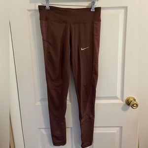 Nike Leggings with side pockets and back zipper pocket and cinch-able waist